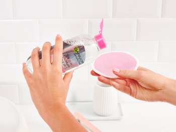 Garnier Micellar Cleansing Water poured on a Micellar Cleansing Eco Pad.