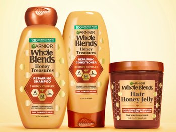 Group shot of Honey Treasures hair care system - repairing shampoo, conditioner, and Honey Jelly. Full repairing system for damaged, dry hair.