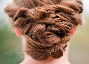 Braided bun hairstyle for holiday season - Garnier