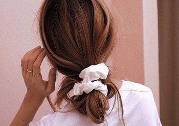 Sleek low bun for holiday season - Garnier