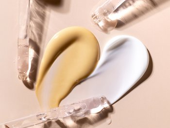 Swirls of different moisturizers are displayed, likely showcasing varying textures and formulations.