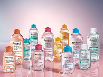 A group of various Garnier Micellar Water bottles, highlighting the different types available for different skin needs.