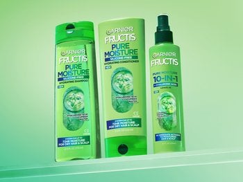 Three Garnier Fructis Pure Moisture products: Hydrating Shampoo, Hydrating Conditioner, and a 10-in-1 Leave-in, all featuring Hyaluronic Acid + Cucumber Water.