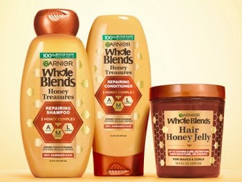 Group shot of Honey Treasures hair care system - repairing shampoo, conditioner, and Honey Jelly. Full repairing system for damaged, dry hair.
