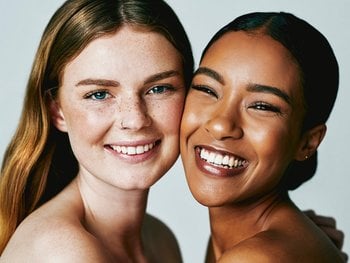 Two friends radiate happiness, their skin refreshed after cleansing with Micellar Water.