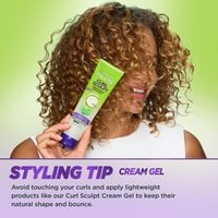Styling tip: woman holding Curl Sculp Conditioning Cream Gel.