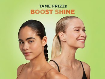 A woman with black hair with a braided hair style and a woman with blonde hair in a pony tail with un-frizzed hair.