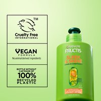 A regular sized bottle of Garnier Fructis Sleek & Shine Leave-In Conditioner on the right side, while the left side features claims such as "Cruelty Free International", "Vegan Formula, No animal derived ingredients" and "Bottle without cap made of 100% recycled plastic", indicating Garnier's Greener Beauty commitments.
