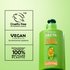 A regular sized bottle of Garnier Fructis Sleek & Shine Leave-In Conditioner on the right side, while the left side features claims such as "Cruelty Free International", "Vegan Formula, No animal derived ingredients" and "Bottle without cap made of 100% recycled plastic", indicating Garnier's Greener Beauty commitments.