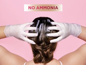 Model applying Color Retouch to hair with gloves.